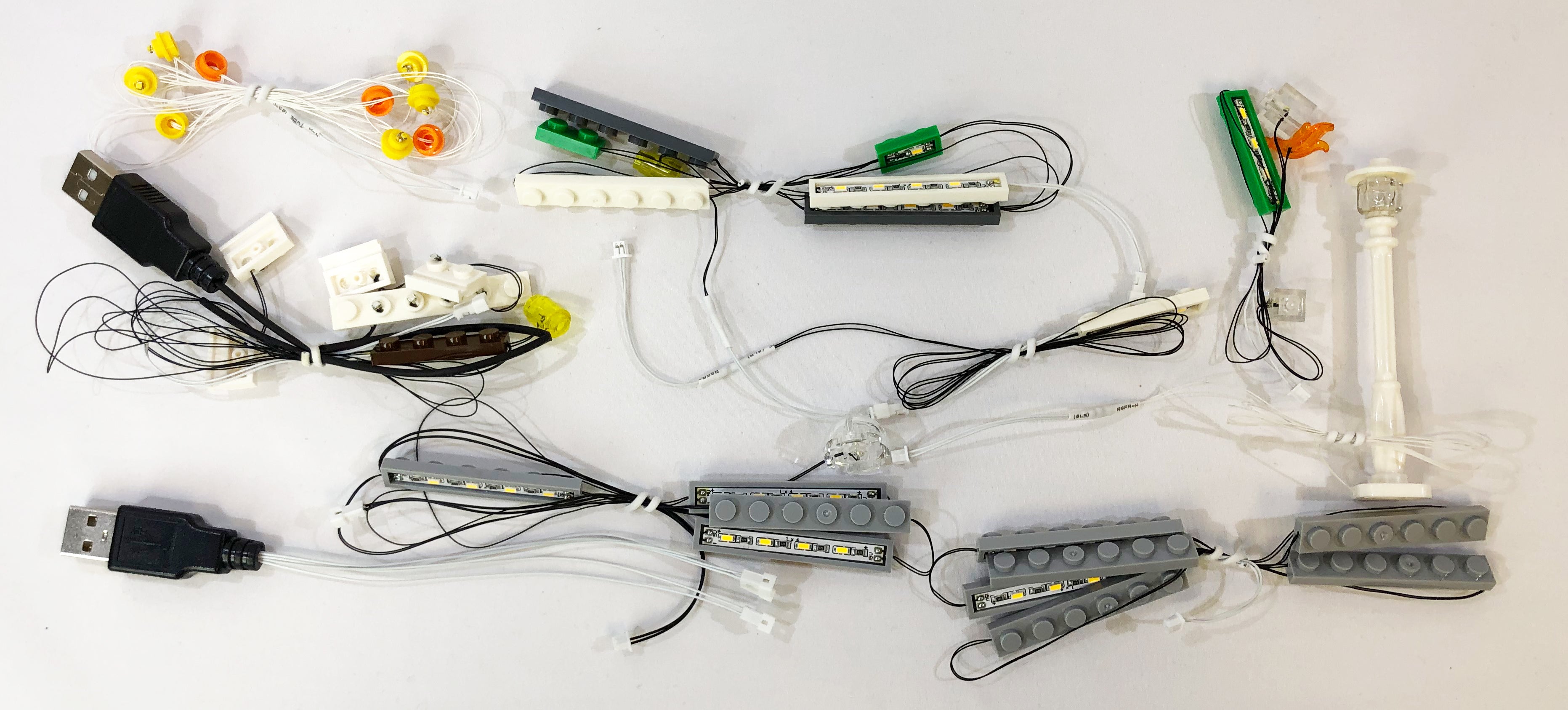 Brick Loot light strings, custom created for the LEGO Creator Expert Bookshop set 10270. The light strings easily connect to the USB (pictured) with mini plugs.